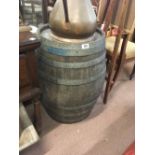 20 gallon wooden whiskey barrel with wooden hoop.