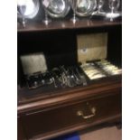 Two cutlery boxes and miscellaneous loose cutlery.