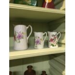 Three floral jugs.