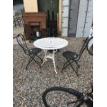 Aluminium garden table with two chairs.