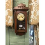 Edwardian walnut wall clock.