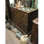 Georgian oak chest of drawers with two short drawers over three graduating drawers with bracket