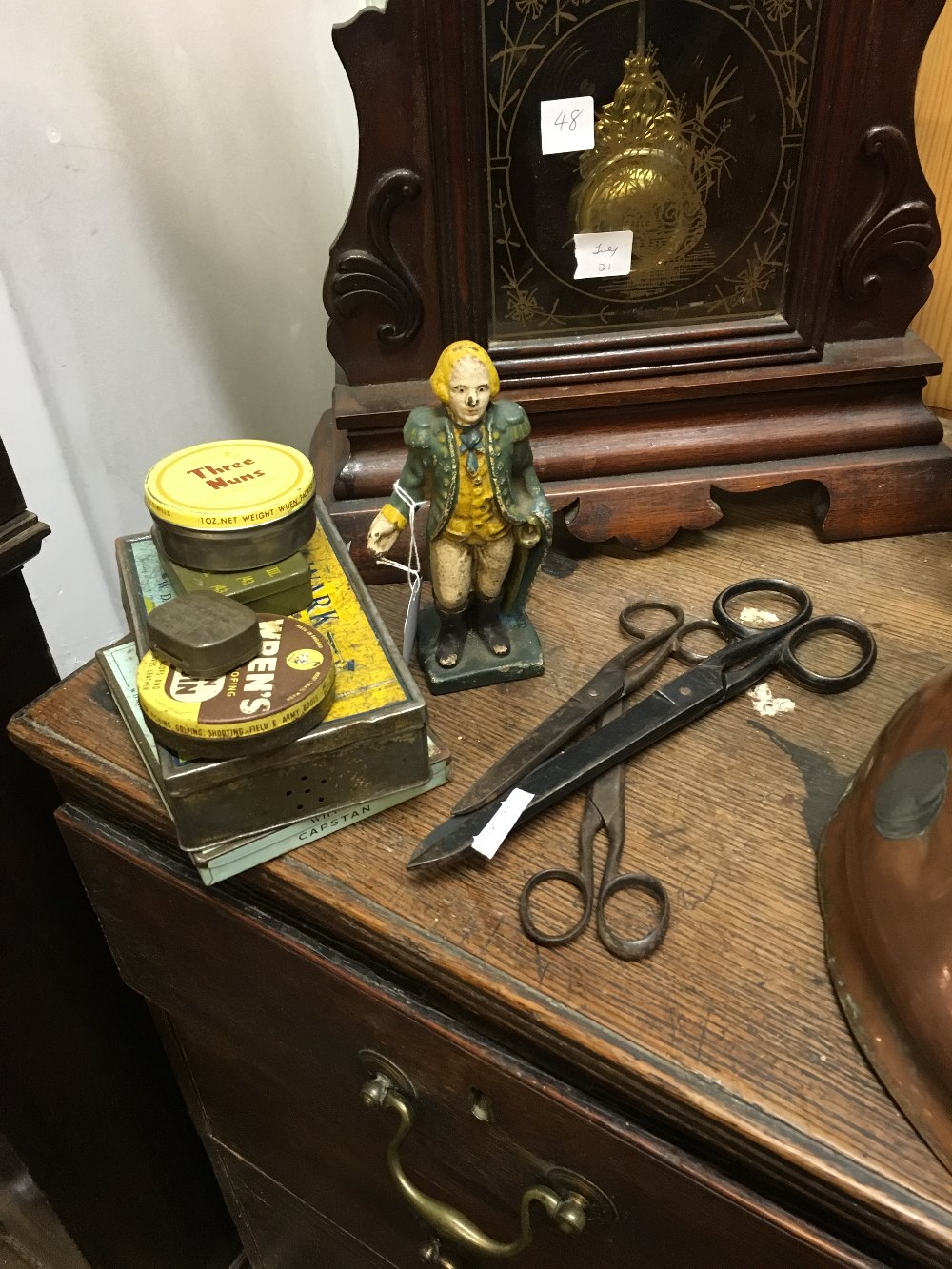 Misc. lot of advertisement tins, cast iron figure and three pairs of scissors.