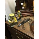 Misc. lot of advertisement tins, cast iron figure and three pairs of scissors.