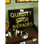 QUALITY SHOE REPAIRS glass advertisement.