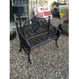 Decorative cast iron two seater garden bench.