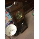 1930's oak wall clock with silver dial.