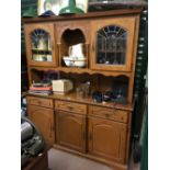 Modern oak kitchen dresser with leaded doors.