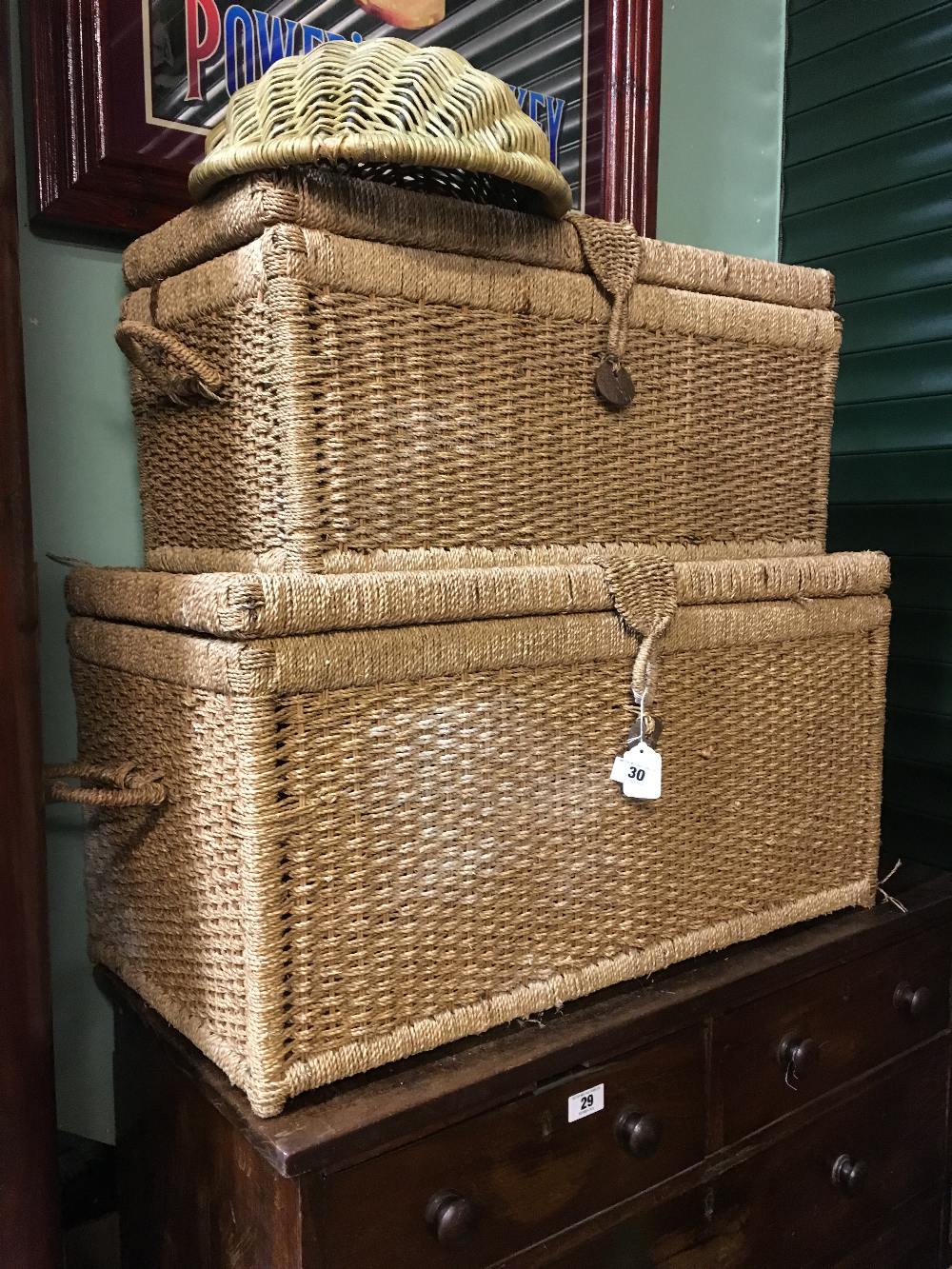 Two rope laundry chests and one wicker fruit bowl.