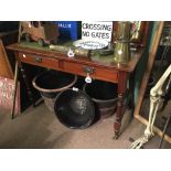 Ornate Victorian writing table with green tooled leather top.