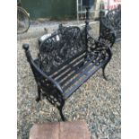 Decorative cast iron two seater garden bench.