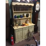 Painted pine dresser with two shelves over three drawers over two panelled doors.