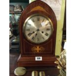 Victorian mahogany inlaid mantle clock with silver dial.