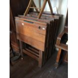 Set of eight folding pitch pine study desks.