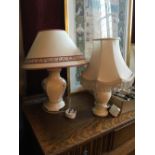 Two table lamps with shades.