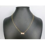 VAN CLEEF & ARPELS. Piccolo collier in oro giallo 18 kt. composto da ciondolo a forma di papillon in