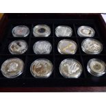 PRESENTATION BOXED COINS INCLUDING NEW ZEALAND $10 COIN, COOK ISLAND $5 COIN, ALDERNEY 2002 £5 COIN,