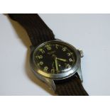 VINTAGE BUREN MILITARY WRISTWATCH ON CANVAS STRAP WITH NUMERALS 355855 TO REVERSE (TICKS WHEN