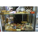 TWO SHELVES OF ASSORTED DOMINOES, PLAYING CARDS, CHESS PIECES, DRAUGHTS PIECES, CRIBBAGE BOARD,