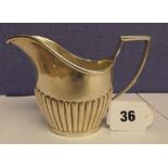 HM LONDON SILVER CREAM JUG WITH SHAPED HANDLE 4.