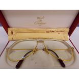 A PAIR OF CARTIER SPECTACLES IN ORIGINAL BOX WITH CLOTH AND CERTIFICATE OF AUTHENTICITY