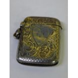 HM BIRMINGHAM SILVER VESTA CASE WITH ENGRAVED DECORATION AND MONOGRAMMED HEART CARTOUCHE