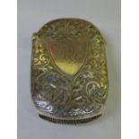 HM BIRMINGHAM SILVER VESTA CASE ELABORATELY DECORATED WITH FOLIATE SCROLLS AND MONOGRAMMED SHIELD