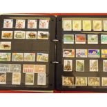 RED BINDER OF GB POSTAGE STAMPS