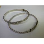 TWO STERLING SILVER ENGRAVED EXPANDING BRACELETS