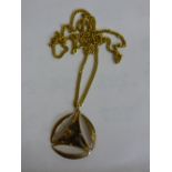 9CT YELLOW GOLD CURB LINK CHAIN AND A 9CT GOLD TRIANGULAR SMOKEY QUARTZ PENDANT