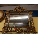 ORNATE GILT WOOD CHERUB CRESTED OVER MANTLE MIRROR