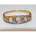 VICTORIAN UNMARKED YELLOW METAL OPAL AND DIAMOND CHIP RING-CENTRAL STONE A/F2.