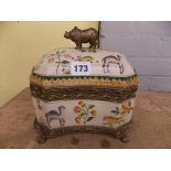 POTTERY CASKET OF SERPENTINE OUTLINE DECORATED WITH GILT METAL RHINOCEROUS FINIAL 20CM H