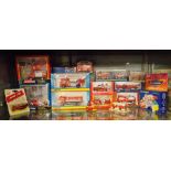 SHELF OF MINT AND BOXED DIE CAST AND PLASTIC MODELS OF FIRE ENGINES, FIRE TRUCKS,