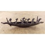 20TH CENTURY BRONZE FIGURE GROUP OF TRIBESMEN IN A BOAT 36CM
