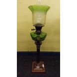 COPPER CORINTHIAN COLUMN OIL LAMP WITH A GREEN RESERVOIR AND A GREEN TINTED FLARED SHADE