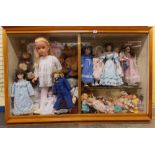 DOUBLE HEIGHT GLAZED CABINET OF VARIOUS 20TH CENTURY DOLLS