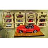 TWELVE MINT BOXED DAYS GONE BY DIECAST MODELS AND A MODEL OF A RED VIPER CAR ON PLINTH