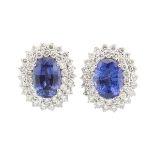 PAIR OF 14K WHITE GOLD EARRINGS each set with an oval cut tanzanite (approx. 7.80ct. & 8.60ct.)