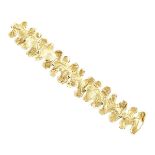 DELRUE 18K YELLOW GOLD BRACELET formed of 8 abstract links length 7" — 17.8 cm., 61.5 grams