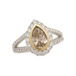 18K WHITE AND YELLOW GOLD RING bezel set with a pear cut brown-yellow diamond (approx. 1.05ct.)
