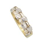 14K YELLOW AND WHITE GOLD HINGED BANGLE channel set with 252 baguette cut diamonds (approx. 10.0ct.