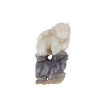 Ａ BLACK-WHITE ‘BOY AND TOAD’ JADE PENDANT, QING DYNASTY 清 黑白玉巧雕踏蟾童子墜 Jade of greyish white and black