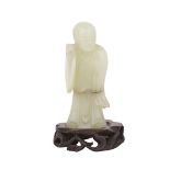 A JADE BOY CARVING, 18TH/19TH CENTURY 18/19世紀 青白玉童子 Depicting a standing boy holding either an