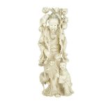 CARVED IVORY CHINESE FIGURE WITH LOTUS BLOSSOMS, CIRCA 1920 約1920年 牙雕仙人童子 Finely rendered, depicting