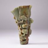 A FINELY CARVED SPINACH JADE ‘LINGZHI’ VASE, QING DYNASTY 清 雲蝠靈芝碧玉瓶 Naturalistically carved in the