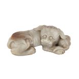 ARCHAIC JADE FU DOG, QING DYNASTY 清 古玉雕佛獅 Finely carved in a recumbent position, with a ball resting