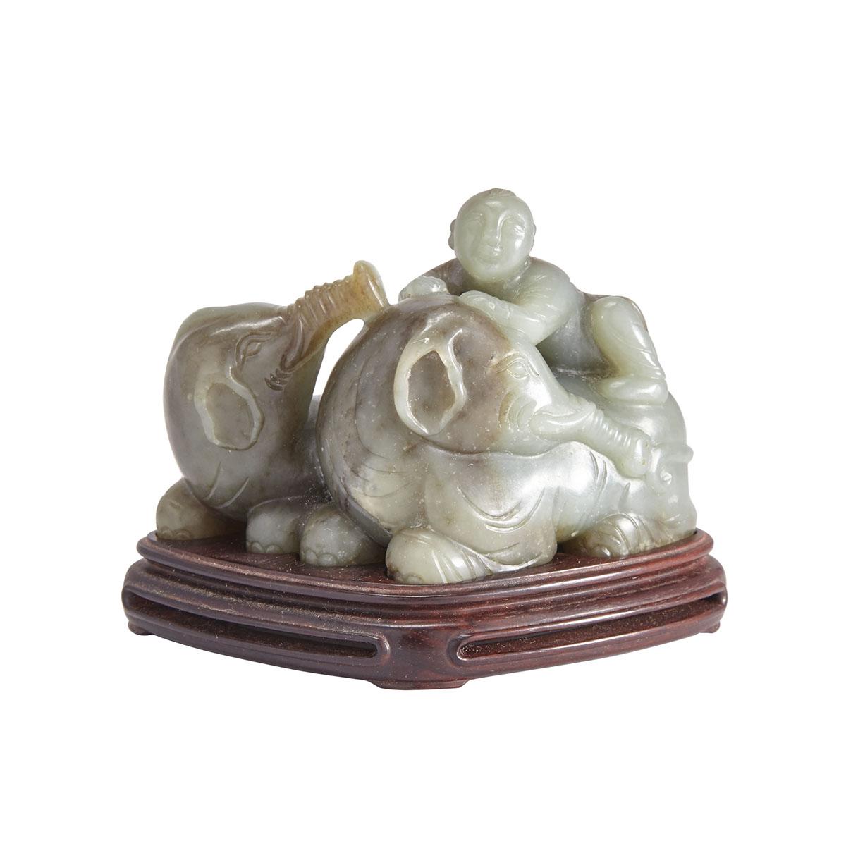 A JADE CARVING OF BOY AND ELEPHANTS WITH A ZITAN STAND, QING DYNASTY 清 童子洗象玉擺件 原配紫檀座 Of reseda green