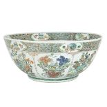 A MASSIVE FAMILLE-VERTE WUCAI PUNCH BOWL, MARK AND PERIOD OF KANGXI (1662-1772) 清康熙 五彩牡丹瑞果紋大碗 Finely