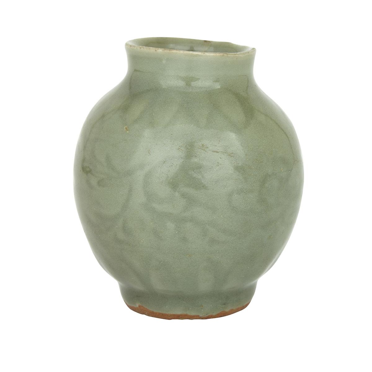 A LONGQUAN CELADON ‘LOTUS’ VASE, MING DYNASTY (1368-1644) 明 龍泉窯刻花小瓶 Heavily potted, supported on a